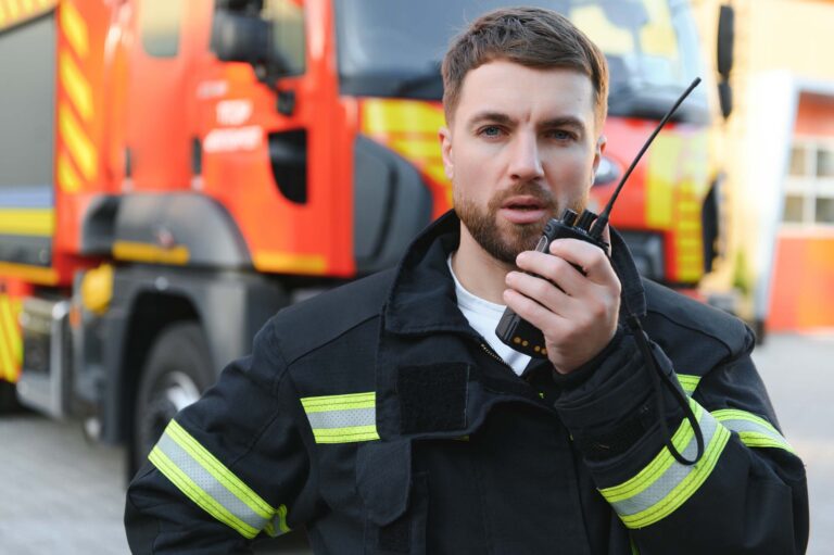 Firefighter talking into a radio